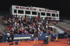 Football stadium of people singing 