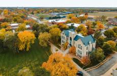 view of Sterling College campus from above showing trees and builidings