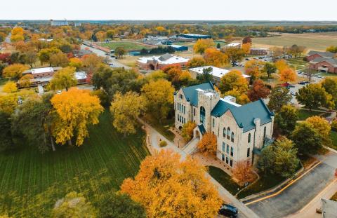 view of Sterling College campus from above showing trees and builidings