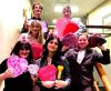 students standing on a stairway holding valentines day hearts